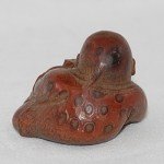 Antiker kleiner Buddha / Boy in Bambus