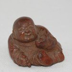 Antiker kleiner Buddha / Boy in Bambus