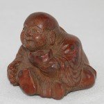 Antiker kleiner Buddha / Boy in Bambus