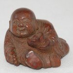Antiker kleiner Buddha / Boy in Bambus